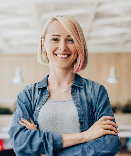 Woman smiling with arms folded
